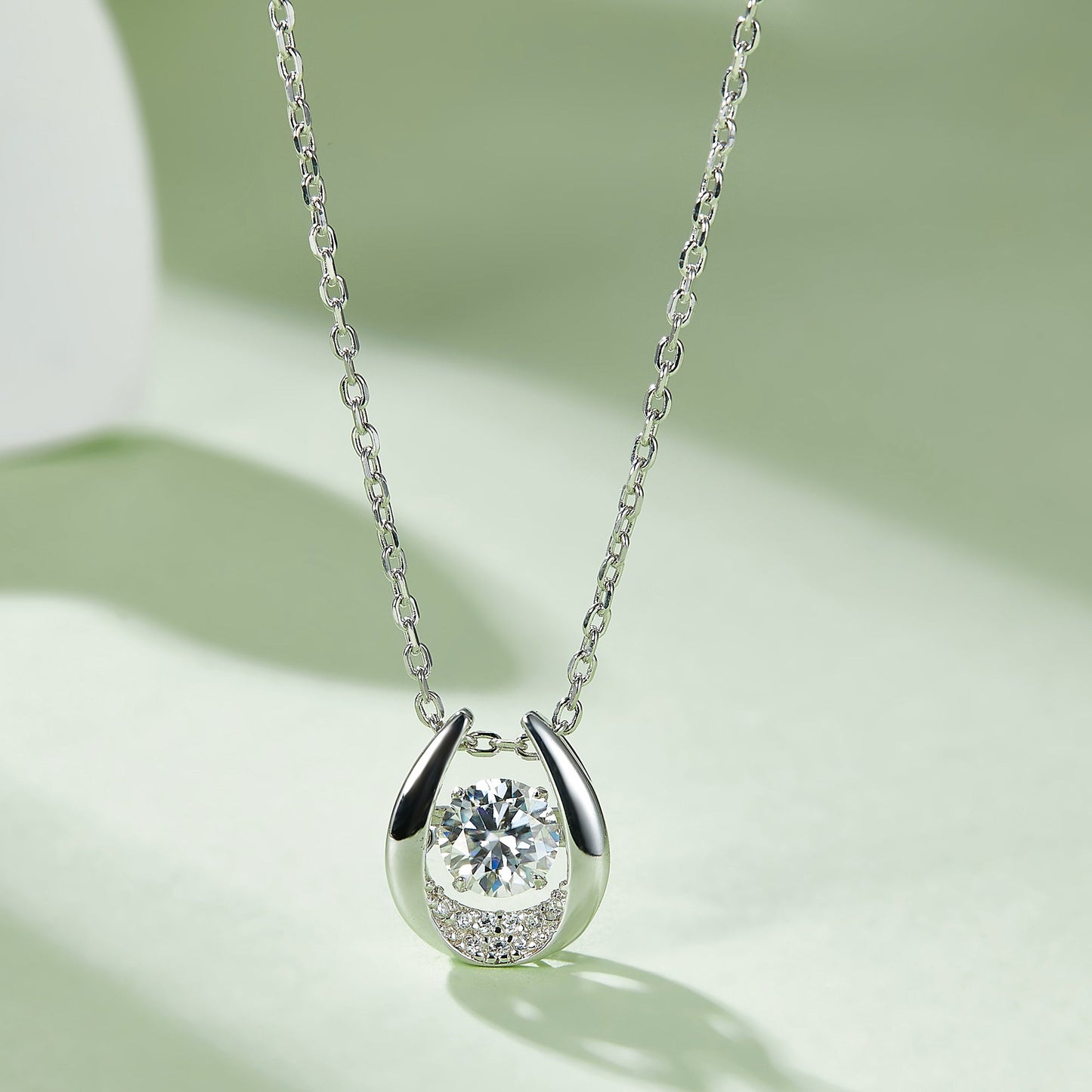 Whirling Radiance: Moissanite Necklace with Round Cut