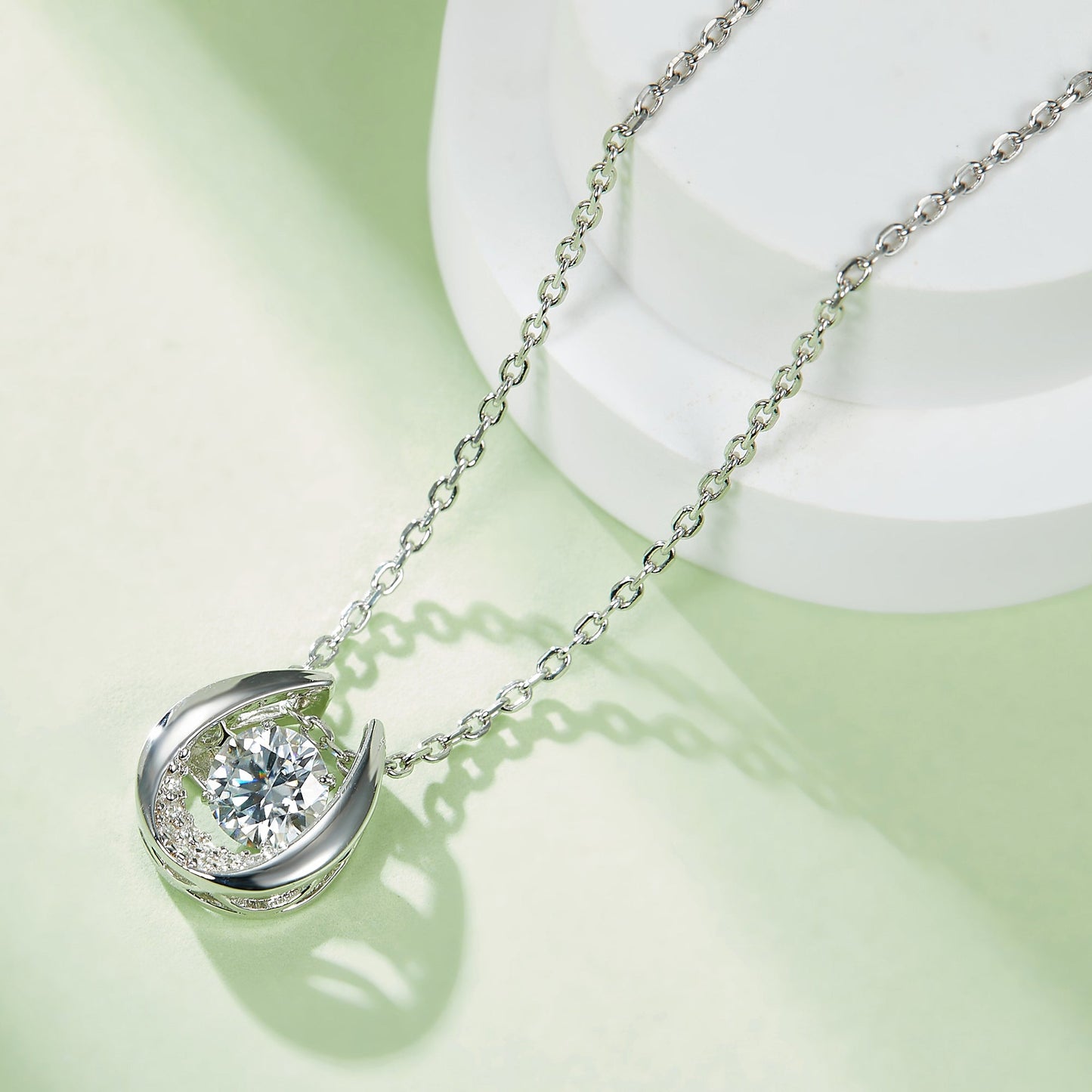 Whirling Radiance: Moissanite Necklace with Round Cut