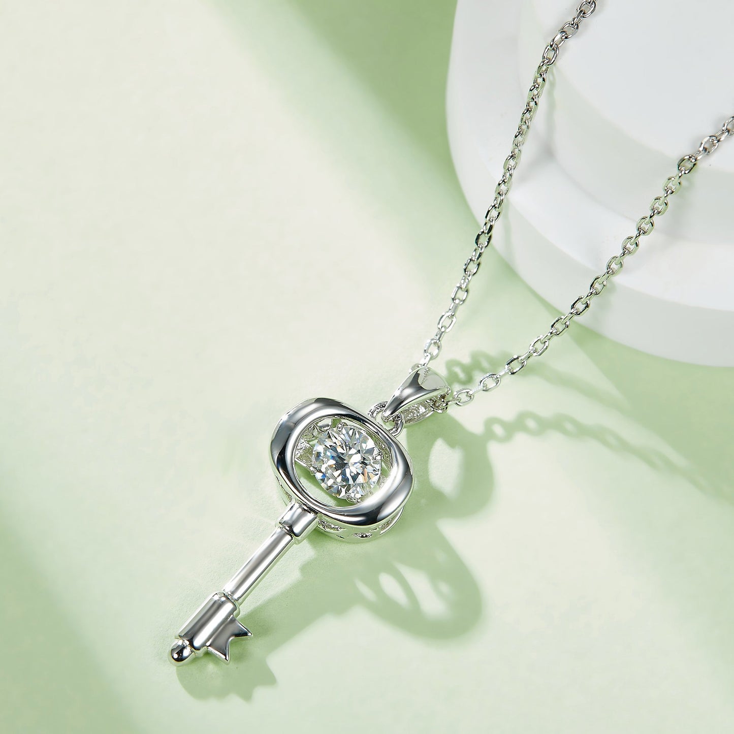 Moissanite pendant with rotating brilliance on a silver chain