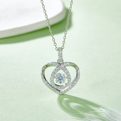 Moissanite pendant with rotating brilliance on a silver chain