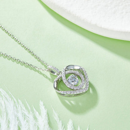 Moissanite pendant with rotating brilliance on a silver chain